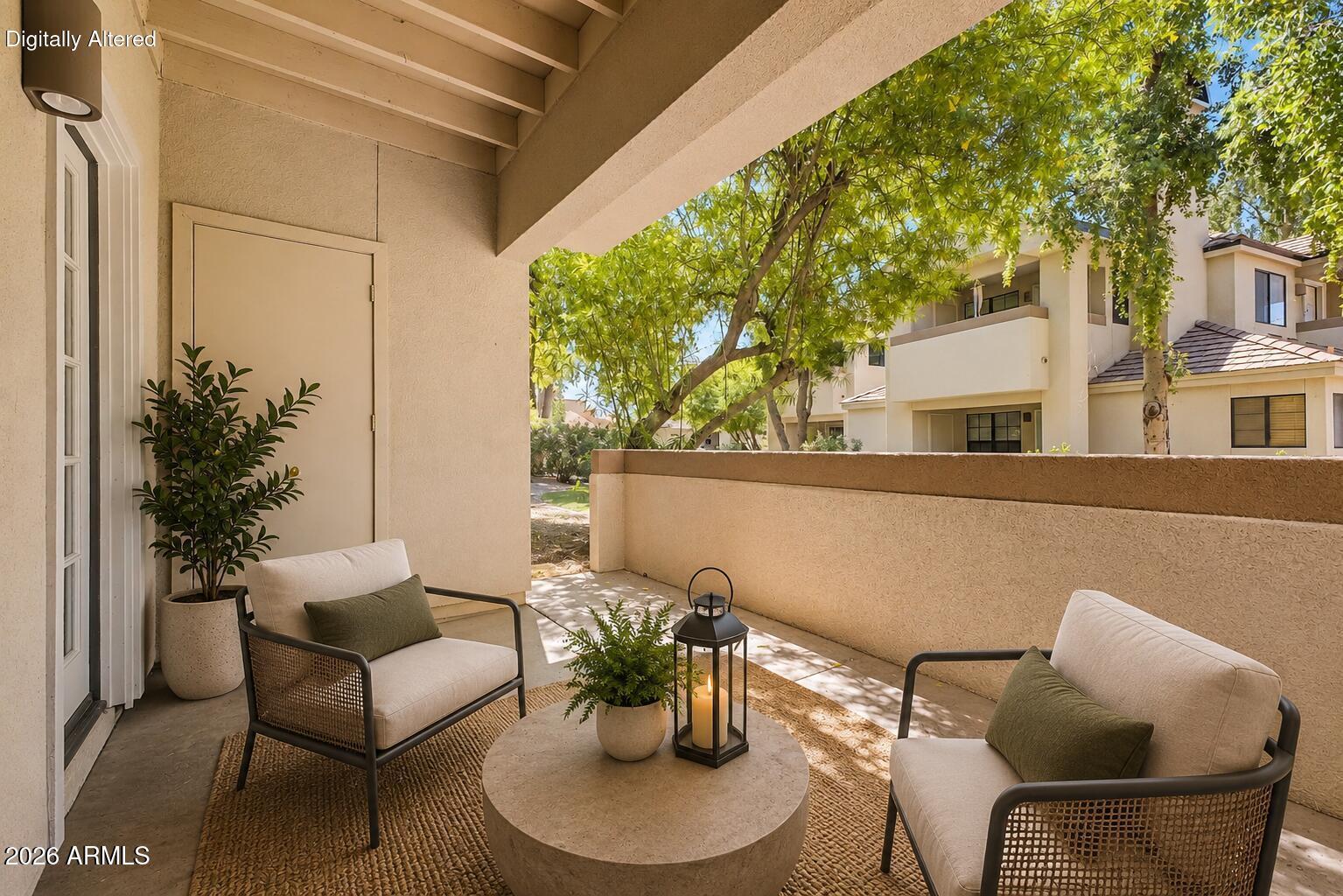 6885 East Cochise Road, Unit 142 Paradise Valley, AZ 85253 - Photo 37 of 47 a view of a patio with couple of chairs