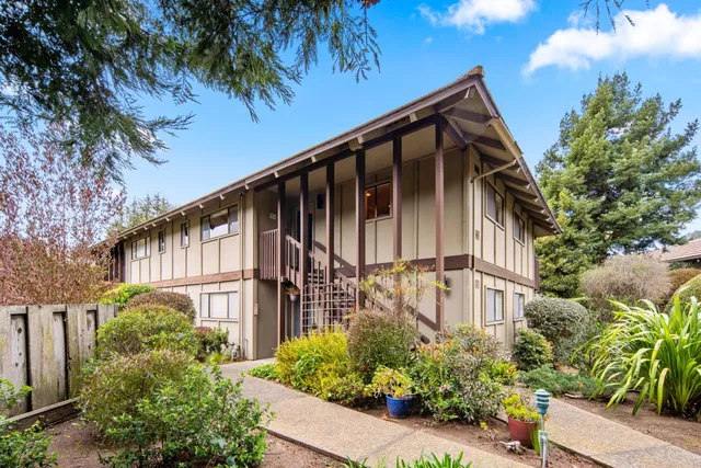 a view of a house with a flower garden