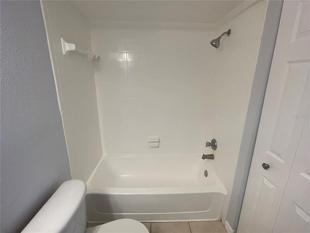 500 South Belcher Road, Unit 138 Largo, FL 33771 - Photo 14 of 31 a bathroom with a bathtub and toilet