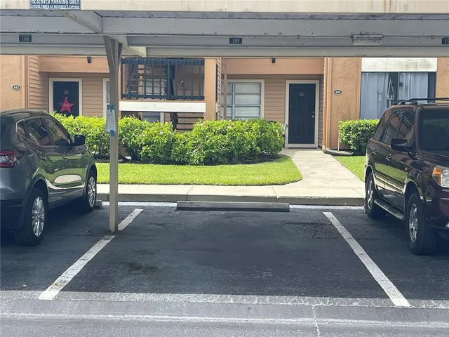 a view of a house with a yard and a fireplace