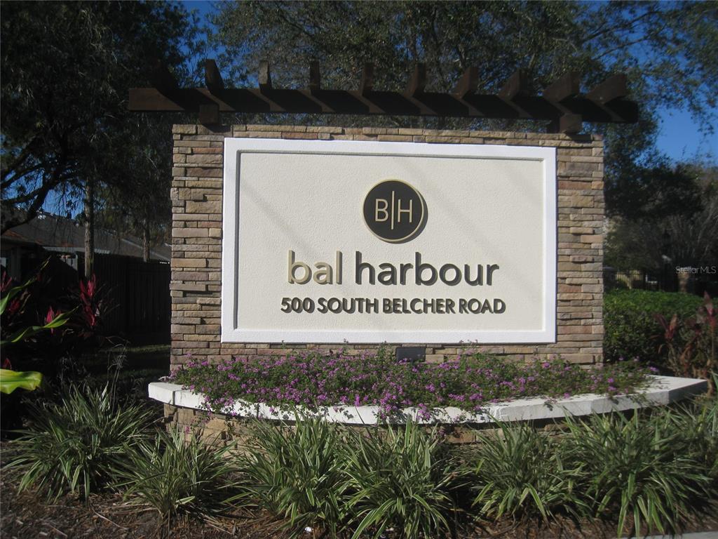 500 South Belcher Road, Unit 138 Largo, FL 33771 - Photo 31 of 31 a view of outdoor space with signage and flags