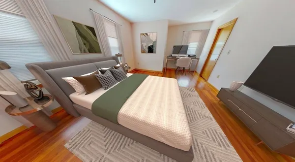 a bed sitting in a bedroom next to a window