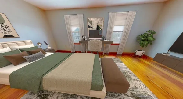 a bedroom with a bed and potted plant