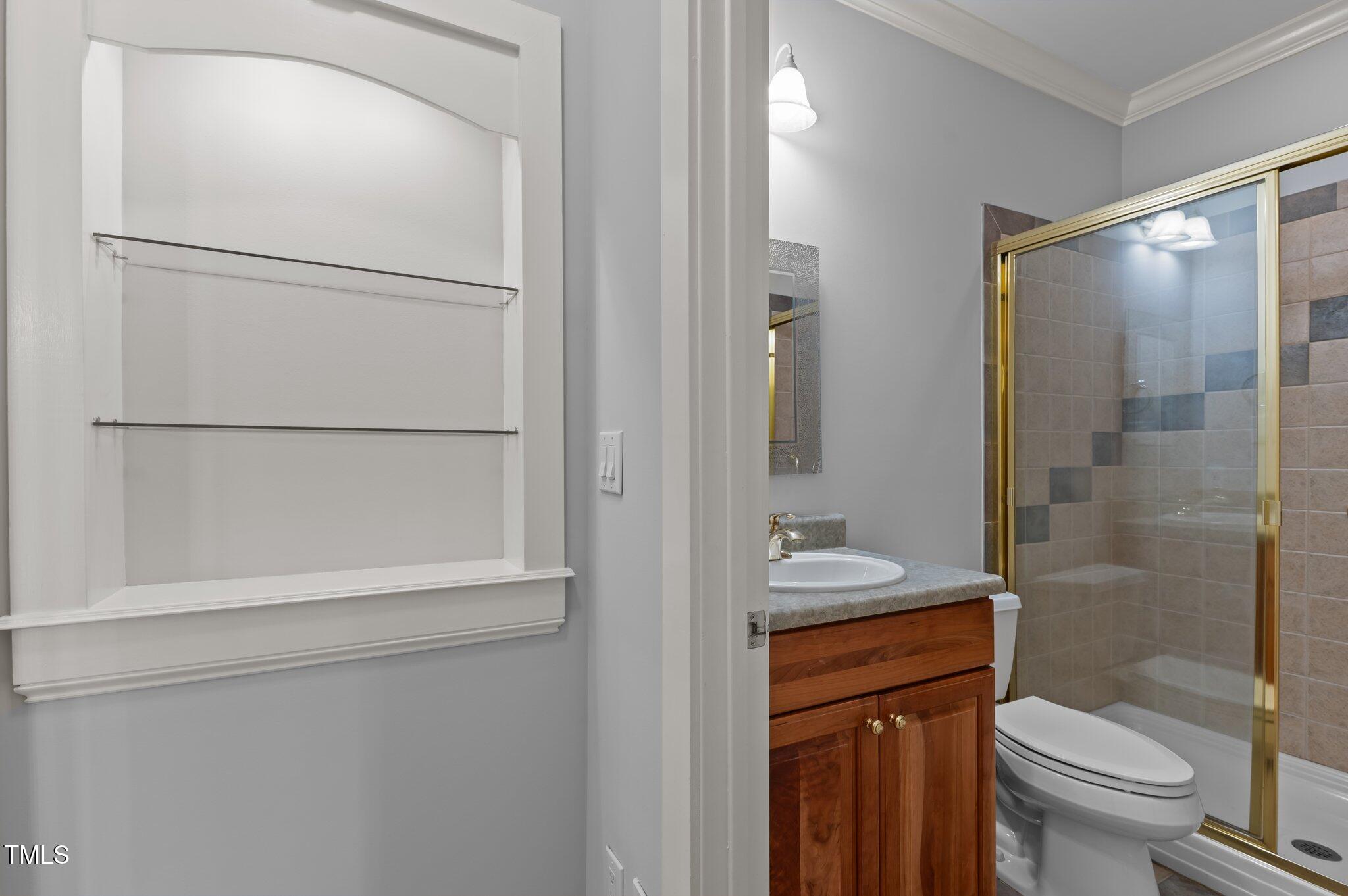 5344 Mill Dam Road Wake Forest, NC 27587 - Photo 22 of 68 a bathroom with a sink a toilet and shower