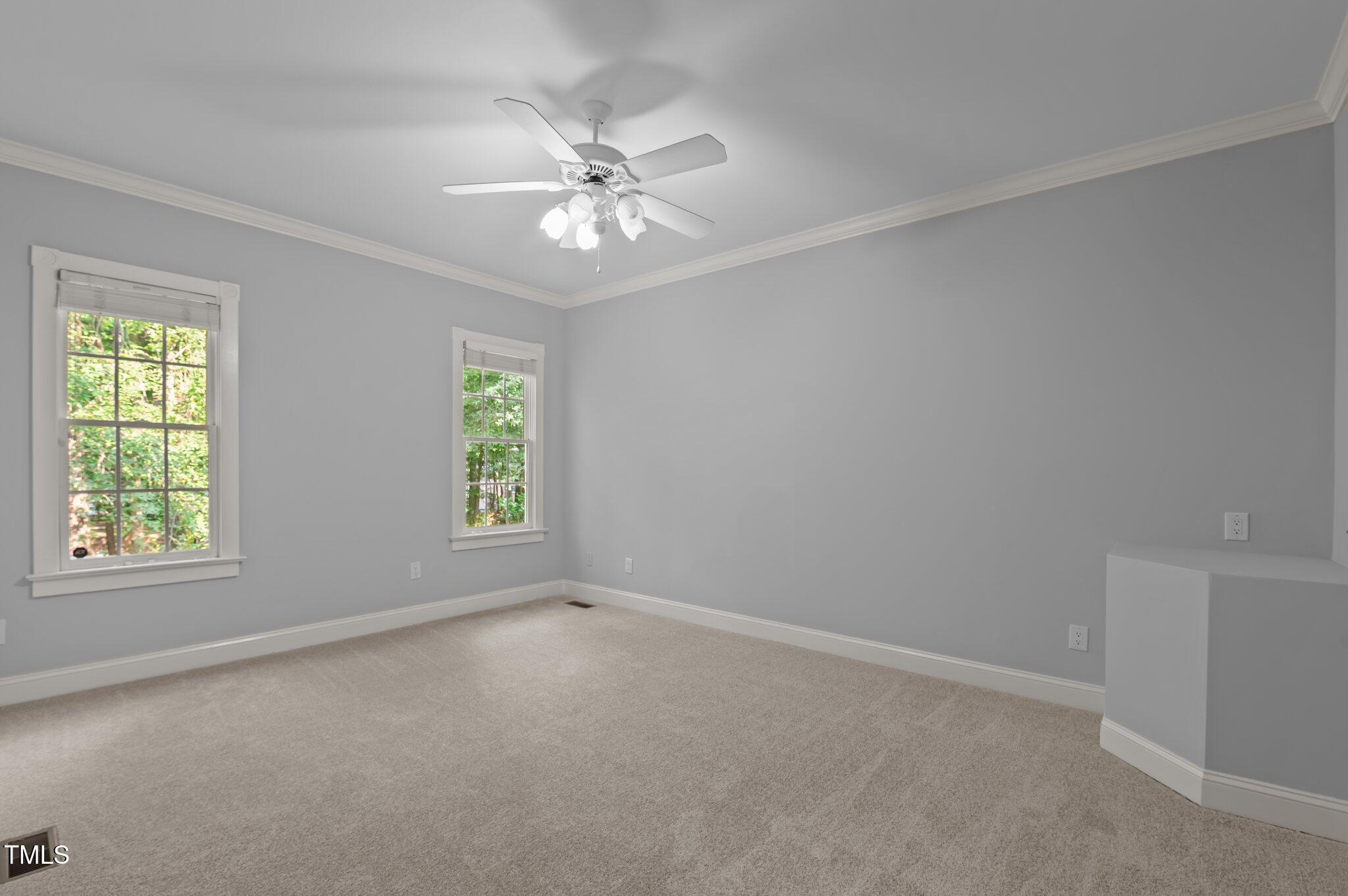 5344 Mill Dam Road Wake Forest, NC 27587 - Photo 23 of 68 an empty room with windows and fan