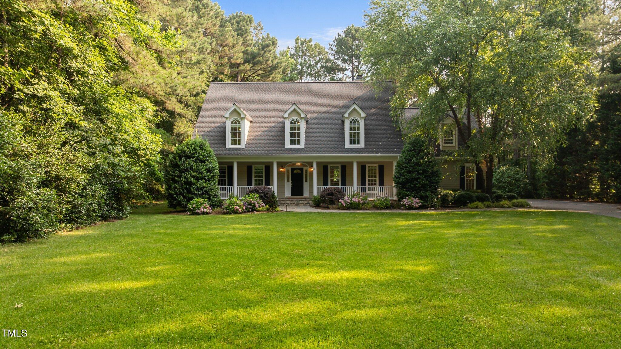 5344 Mill Dam Road Wake Forest, NC 27587 - Photo 8 of 68 a front view of a house with a garden
