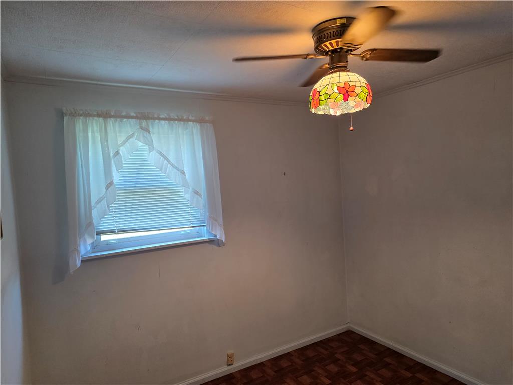 3134 Roxford Road Allentown, PA 18103 - Photo 27 of 34 A quaint bedroom offering natural illumination and a classic ceiling fan.