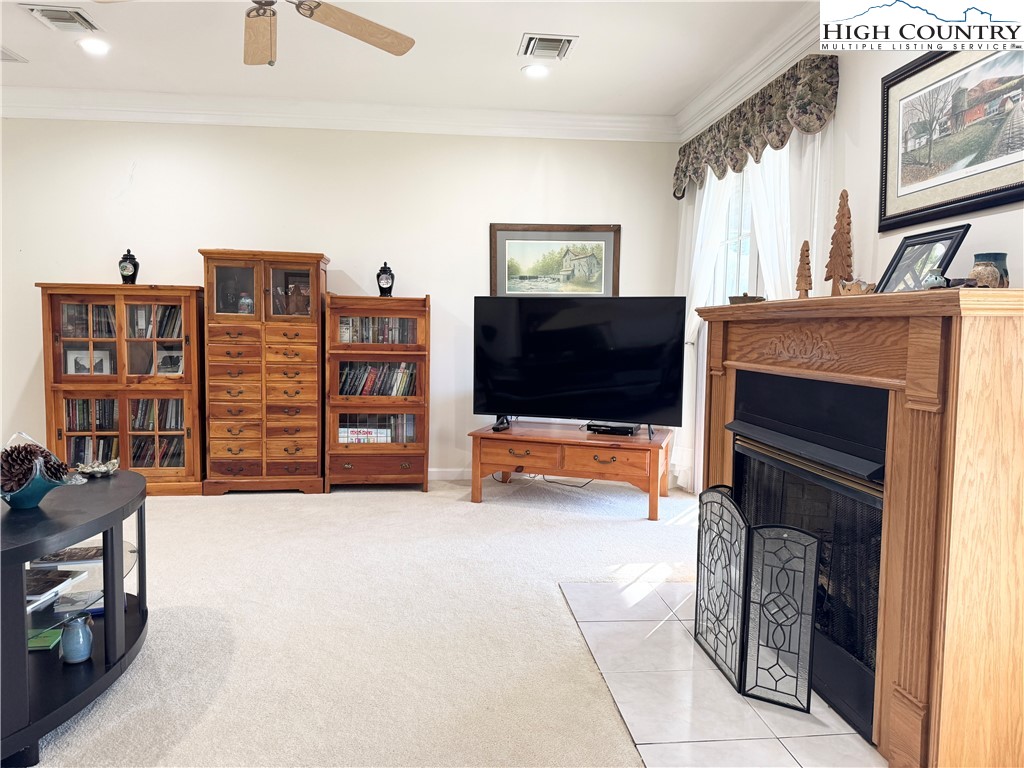 175 Olive Ridge Drive Crumpler, NC 28617 - Photo 13 of 50 a living room with furniture and a flat screen tv