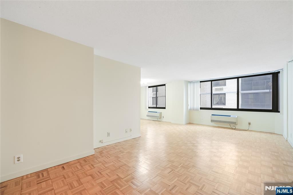 316 Prospect Avenue, Unit 3D Hackensack, NJ 07601 - Photo 14 of 20 a view of an empty room with a window and cabinet