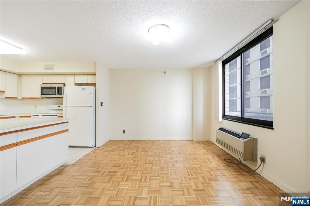 316 Prospect Avenue, Unit 3D Hackensack, NJ 07601 - Photo 20 of 20 a view of a kitchen with an empty space and window