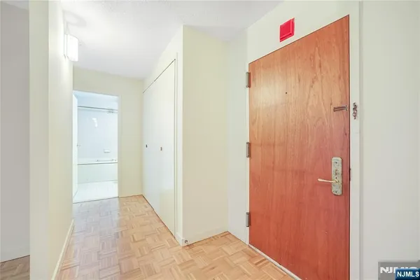 a view of a hallway with closet