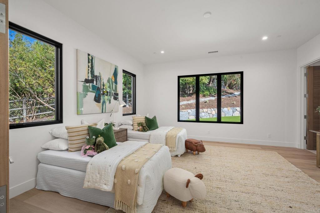 5471-73 La Crescenta Road Rancho Santa Fe, CA 92067 - Photo 14 of 23 a bed room with a bed and a large window