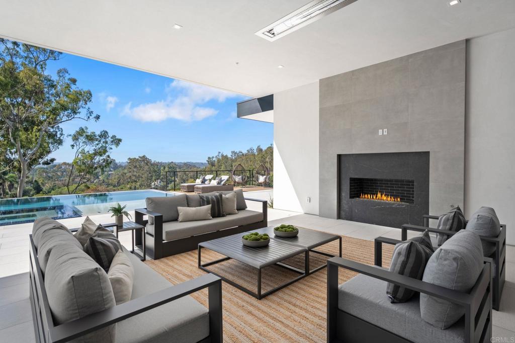 5471-73 La Crescenta Road Rancho Santa Fe, CA 92067 - Photo 16 of 23 a living room with furniture and a fireplace