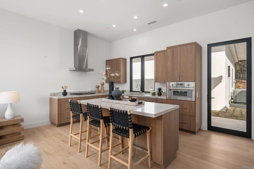 5471-73 La Crescenta Road Rancho Santa Fe, CA 92067 - Photo 20 of 23 a kitchen with appliances a sink and cabinets