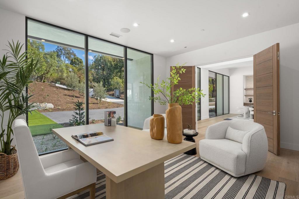 5471-73 La Crescenta Road Rancho Santa Fe, CA 92067 - Photo 10 of 23 a living room with furniture and large windows