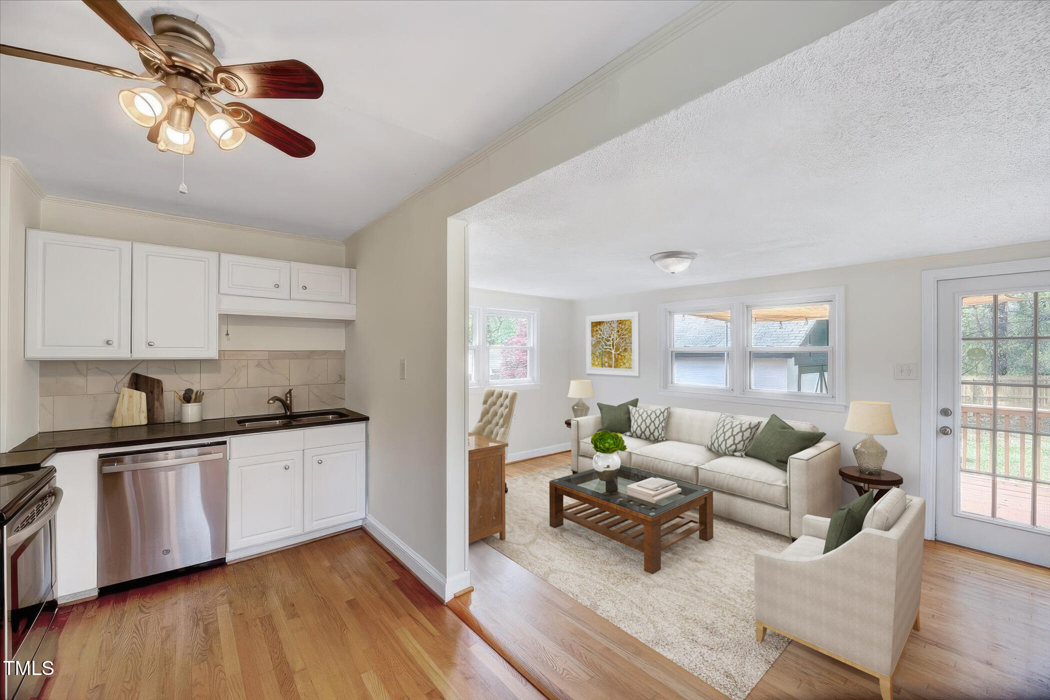 829 Colleton Road Raleigh, NC 27610 - Photo 15 of 27 a living room with furniture and kitchen view
