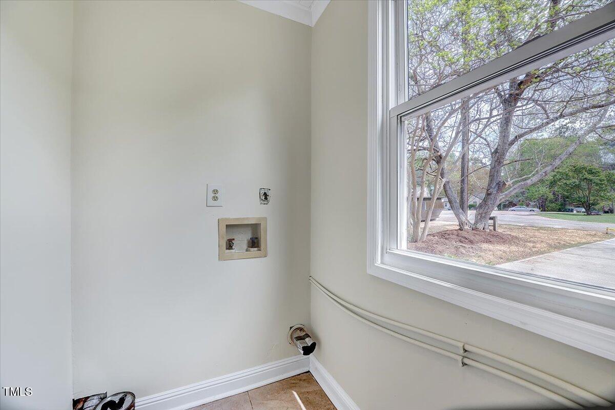 829 Colleton Road Raleigh, NC 27610 - Photo 7 of 27 a view of a door and a window