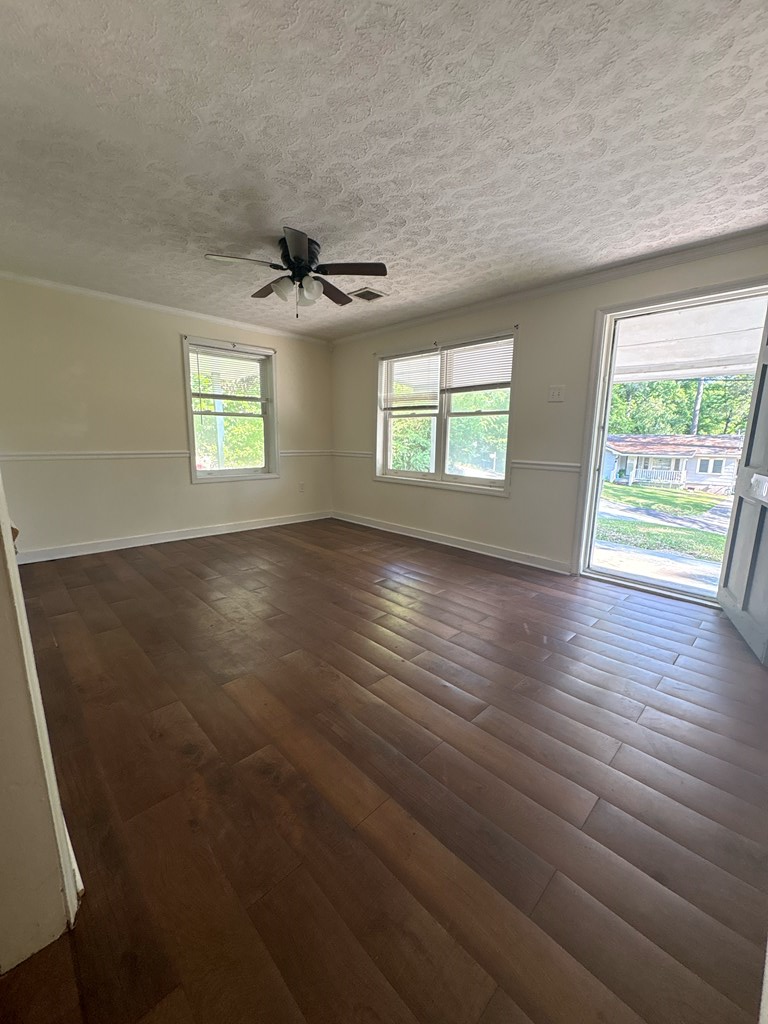 2910 Beech Street Columbus, GA 31909 - Photo 6 of 24 wooden floor in an empty room with a window