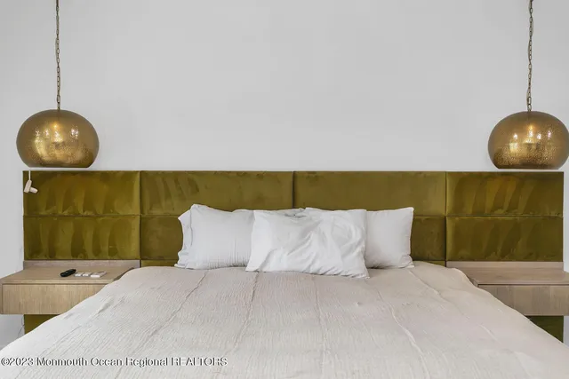 a bedroom with a bed and cabinets