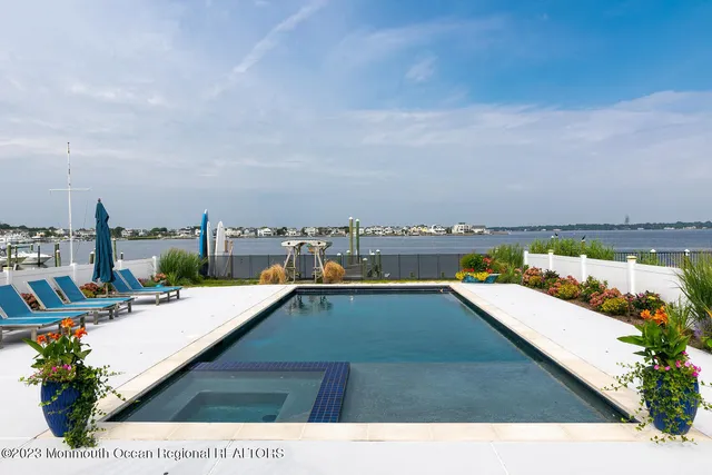 a view of swimming pool with furniture