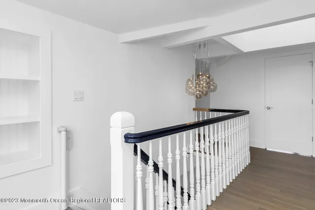 a view of a hallway with a chandelier