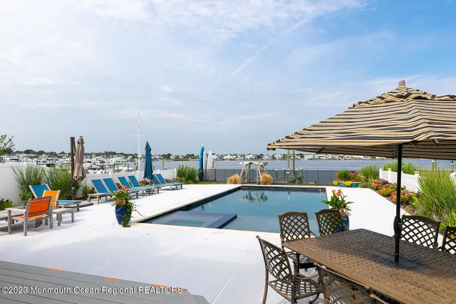 a terrace with outdoor seating and city view