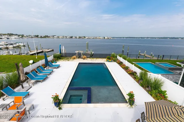 a view of swimming pool with seating space
