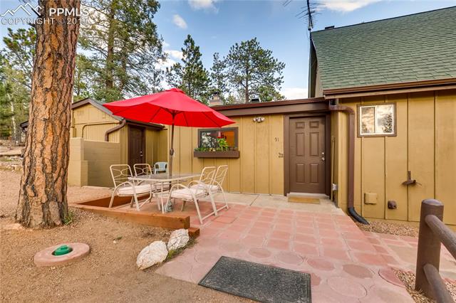 91 Alpine Road Woodland Park, CO 80863 - Photo 4 of 36 Side patio off the main house. Enjoy the great view of Pikes Peak on cool summer evenings.