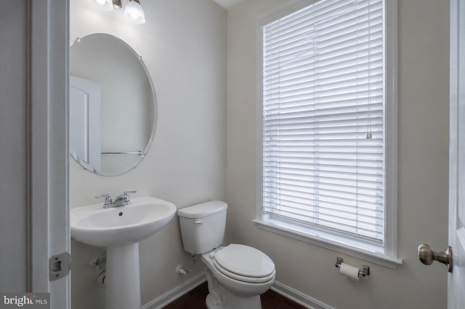 4731 Cambria Road Frederick, MD 21703 - Photo 29 of 63 a bathroom with a sink a toilet and a mirror