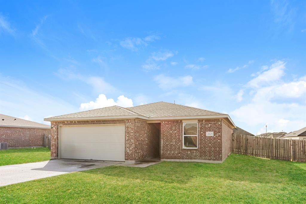 2029 Clay Street Mabank, TX 75147 - Photo 2 of 21 a front view of a house with a yard and garage