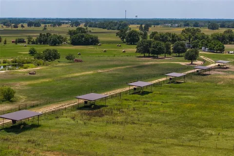 a view of a swimming pool with an outdoor seating and a lake view