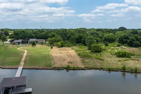 an aerial view of a houses with outdoor space