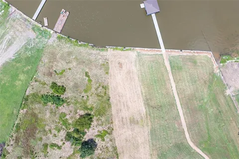 a bathroom with a shower curtain and a large window