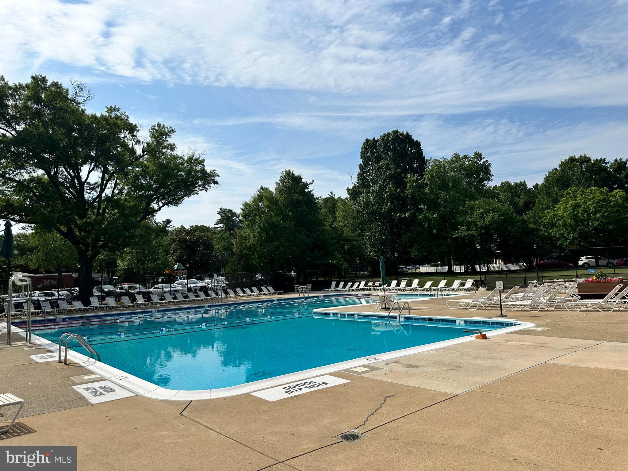 3304 Gunston Road Alexandria, VA 22302 - Photo 3 of 28 a view of a swimming pool with an outdoor space and seating area