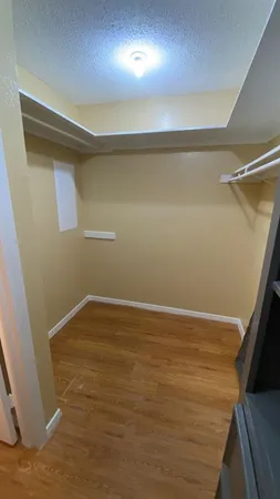 an empty room with a empty space and a window