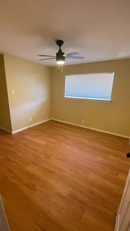 a view of an empty room with a window