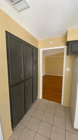 a kitchen with stainless steel appliances kitchen island granite countertop a sink a stove counter space and cabinets