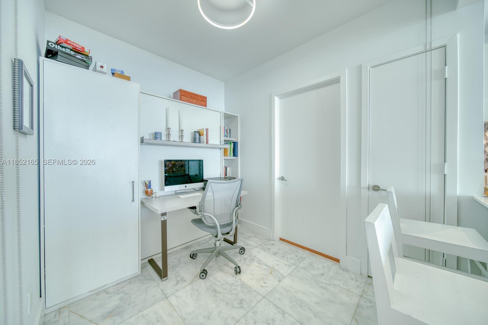 2900 Northeast 7th Avenue, Unit 405 Miami, FL 33137 - Photo 9 of 38 a workspace with furniture and a window