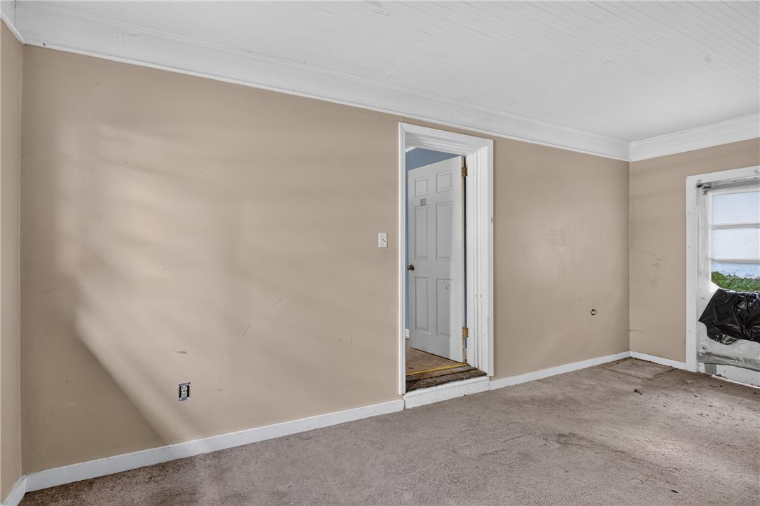 676 Marcengill Road Westminster, SC 29693 - Photo 14 of 32 An open doorway and classic wood trim define this versatile room with plush carpeting.