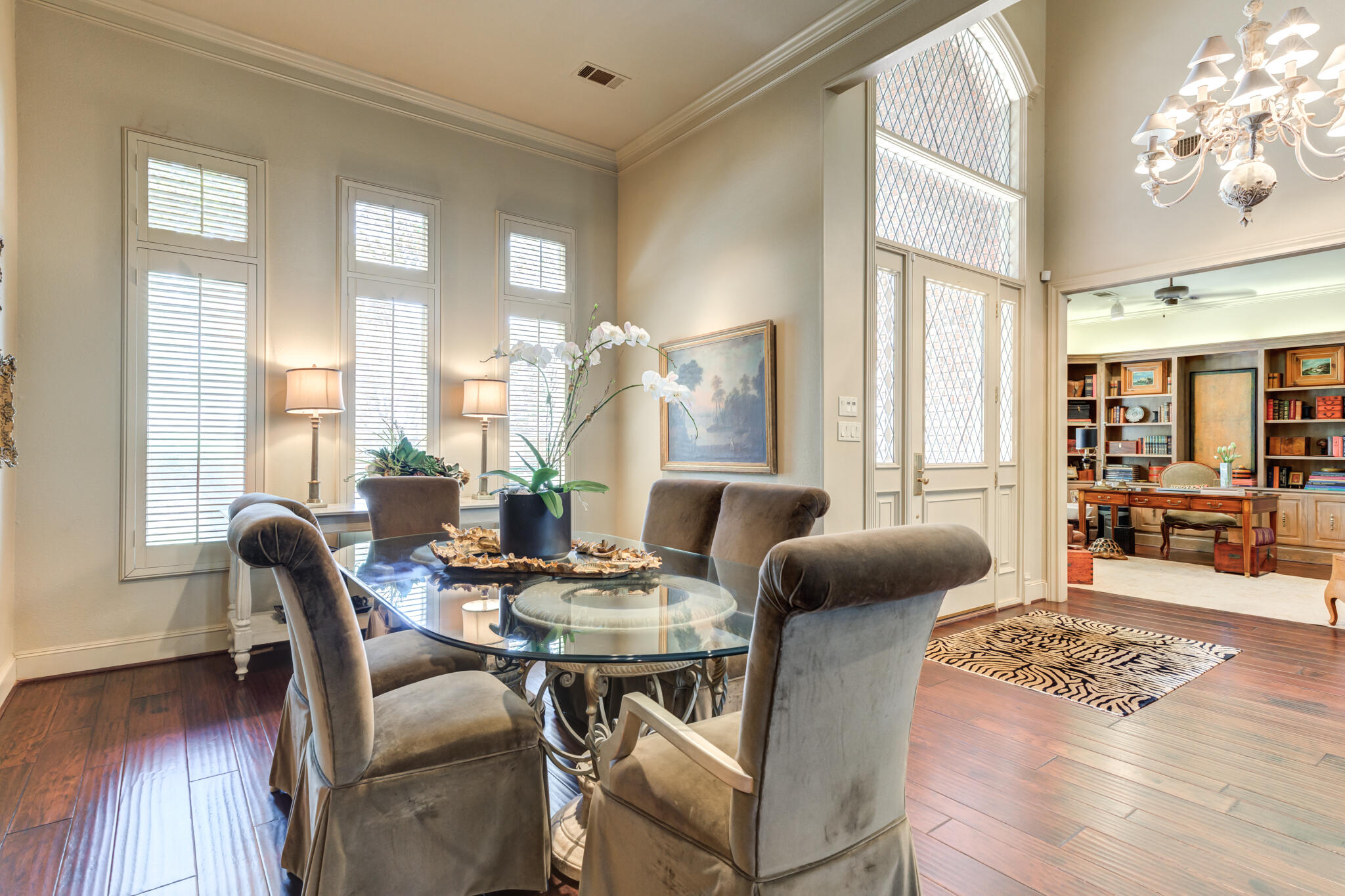 4612 91st Street Lubbock, TX 79424 - Photo 14 of 83 a dining room with furniture wooden floor and a chandelier