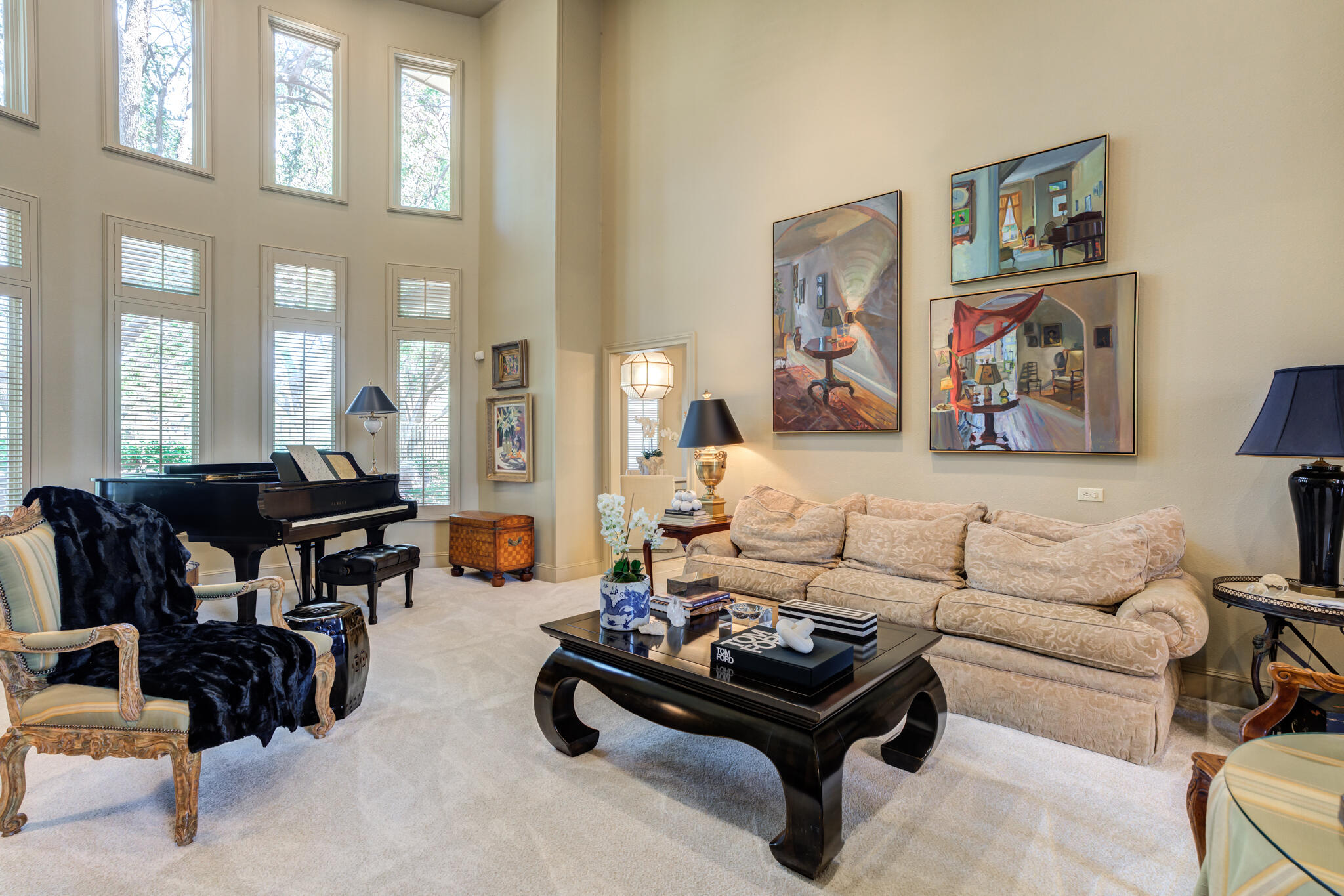 4612 91st Street Lubbock, TX 79424 - Photo 20 of 83 a living room with furniture a couch and paintings on the wall