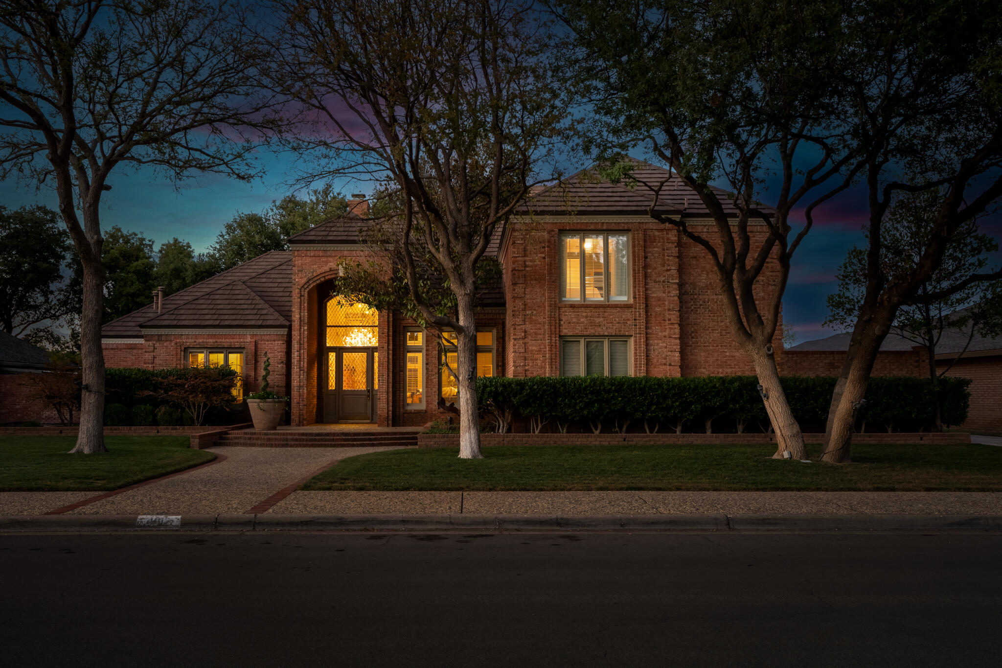 4612 91st Street Lubbock, TX 79424 - Photo 2 of 83 a front view of a house with a yard
