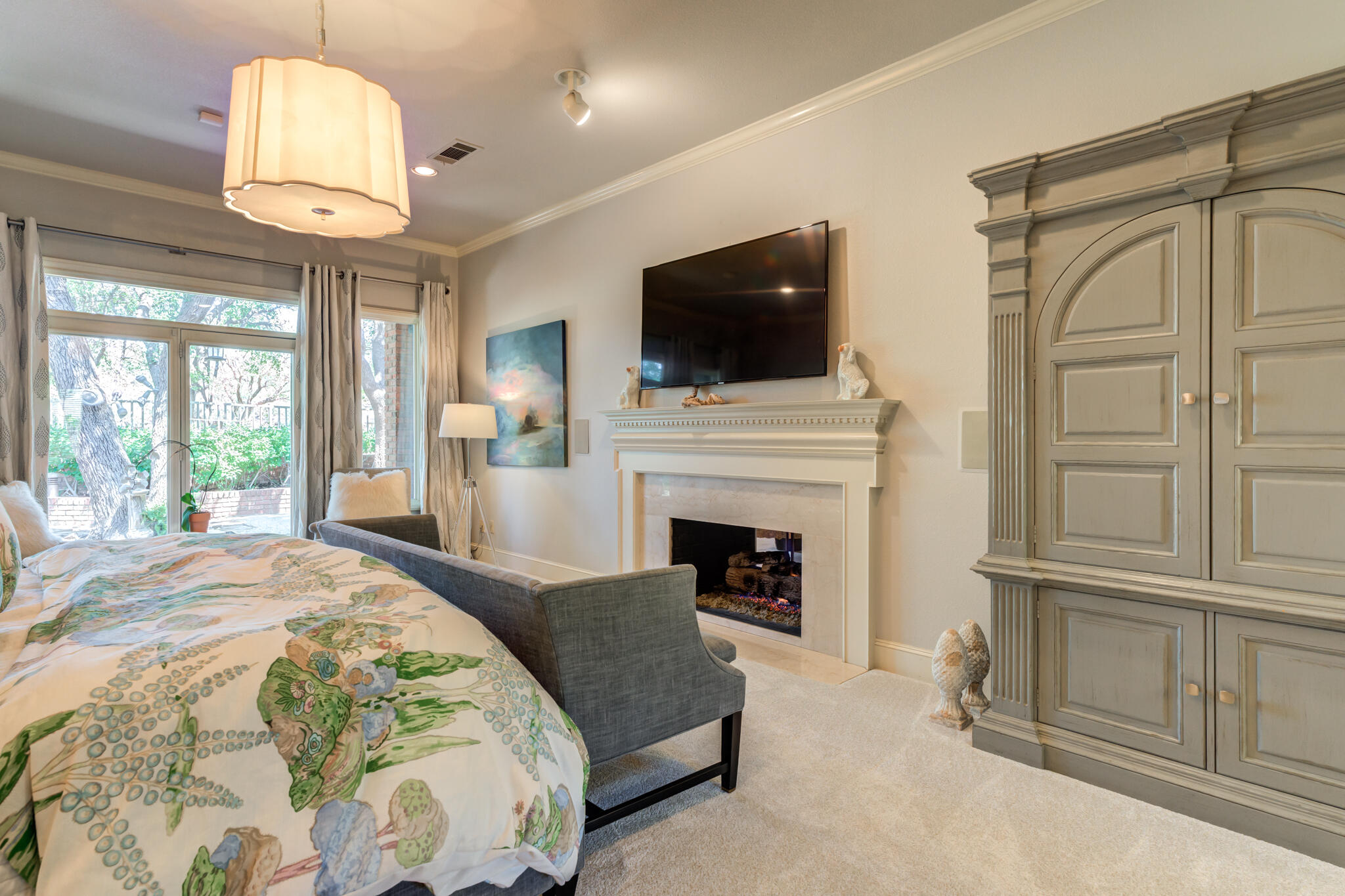 4612 91st Street Lubbock, TX 79424 - Photo 25 of 83 a spacious bedroom with a bed and a flat screen tv