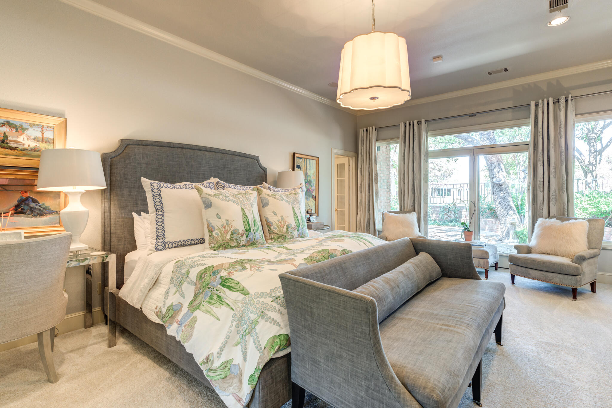 4612 91st Street Lubbock, TX 79424 - Photo 26 of 83 a bedroom with bed and a chandelier