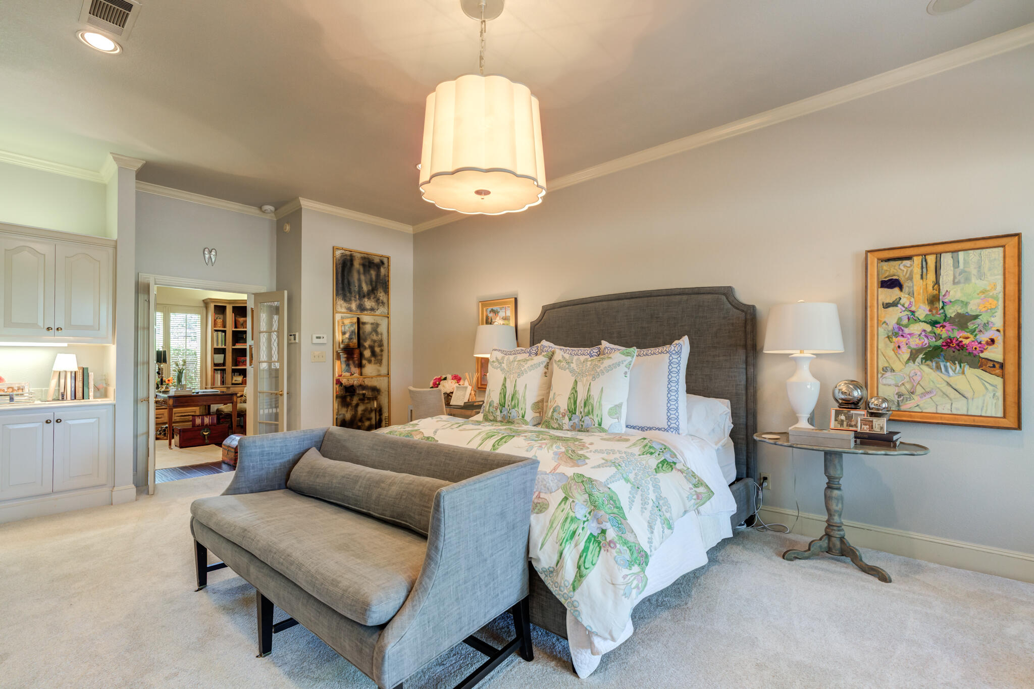 4612 91st Street Lubbock, TX 79424 - Photo 29 of 83 a bedroom with a bed mirror and painting on the wall