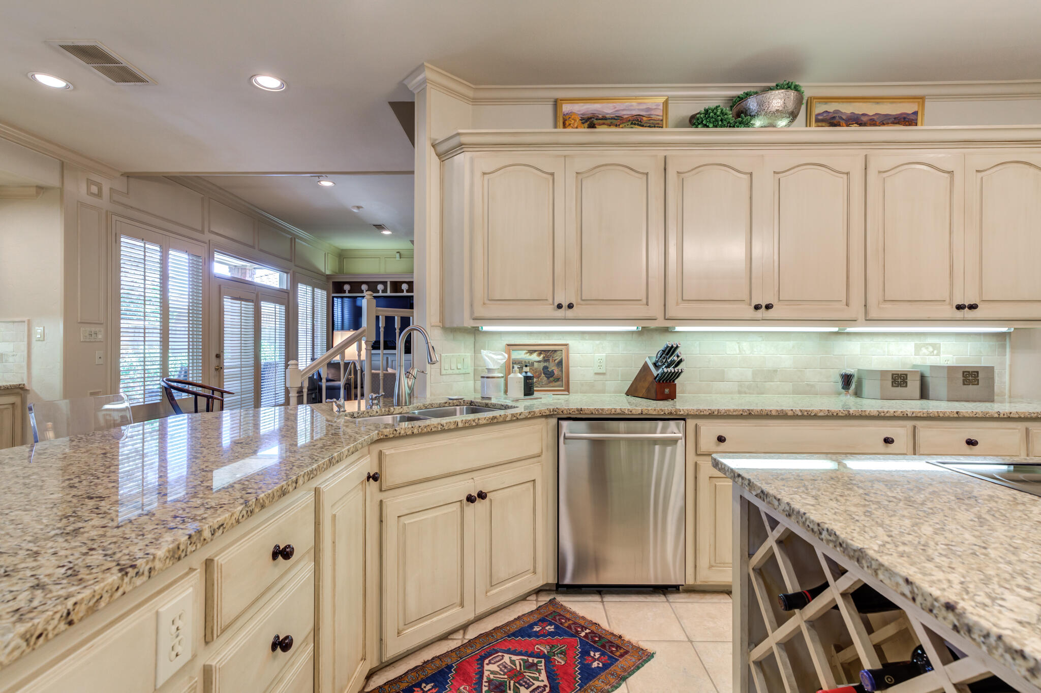 4612 91st Street Lubbock, TX 79424 - Photo 40 of 83 a kitchen with granite countertop a sink and cabinets