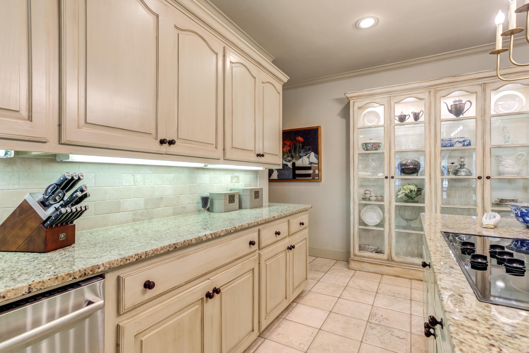 4612 91st Street Lubbock, TX 79424 - Photo 41 of 83 a kitchen with granite countertop a sink a stove and cabinets
