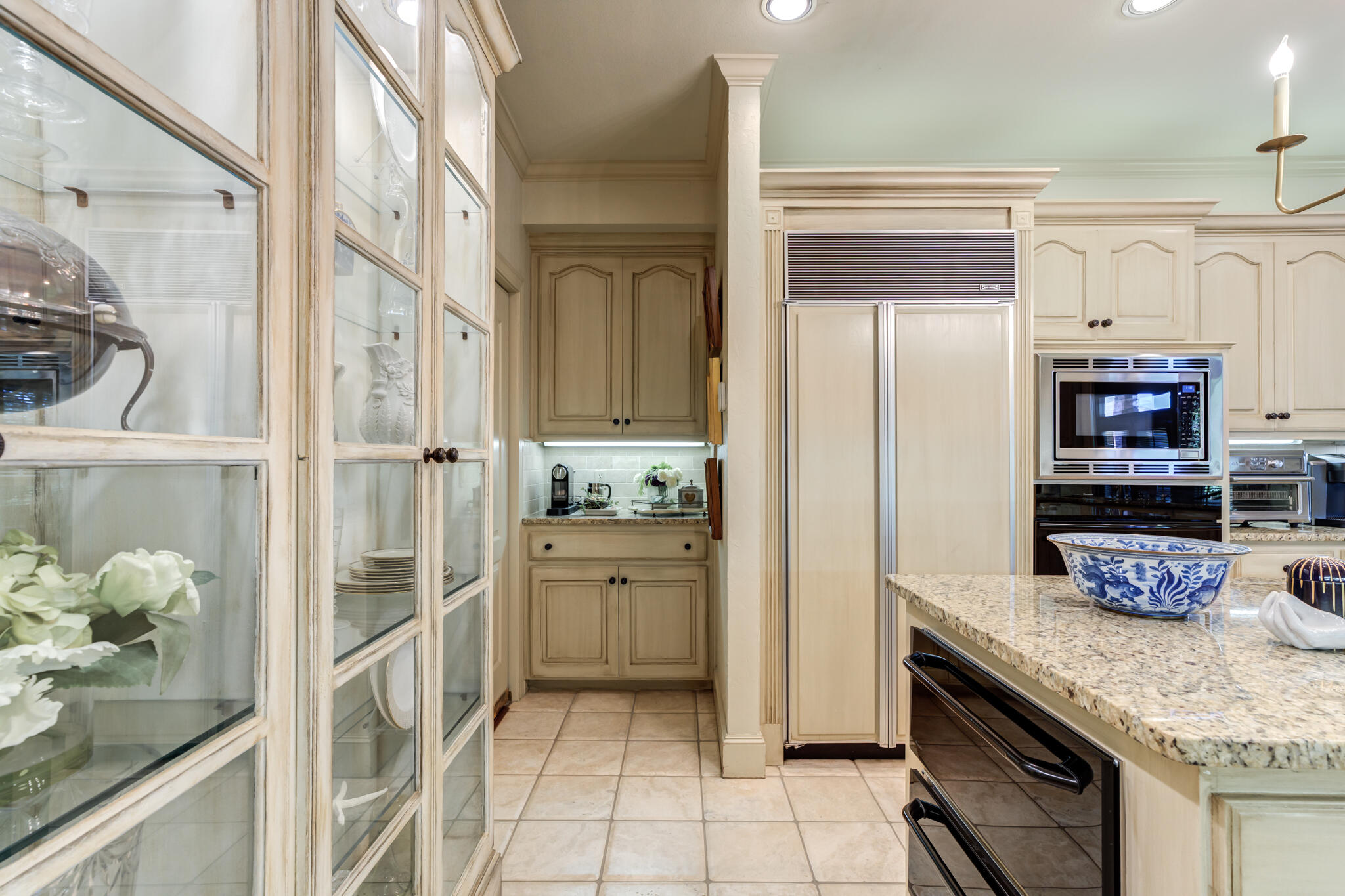 4612 91st Street Lubbock, TX 79424 - Photo 44 of 83 a kitchen with stainless steel appliances granite countertop a refrigerator and a sink