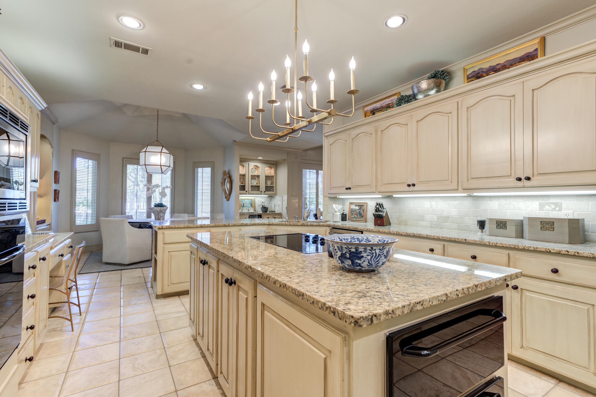 4612 91st Street Lubbock, TX 79424 - Photo 47 of 83 a kitchen with stainless steel appliances granite countertop a sink and cabinets