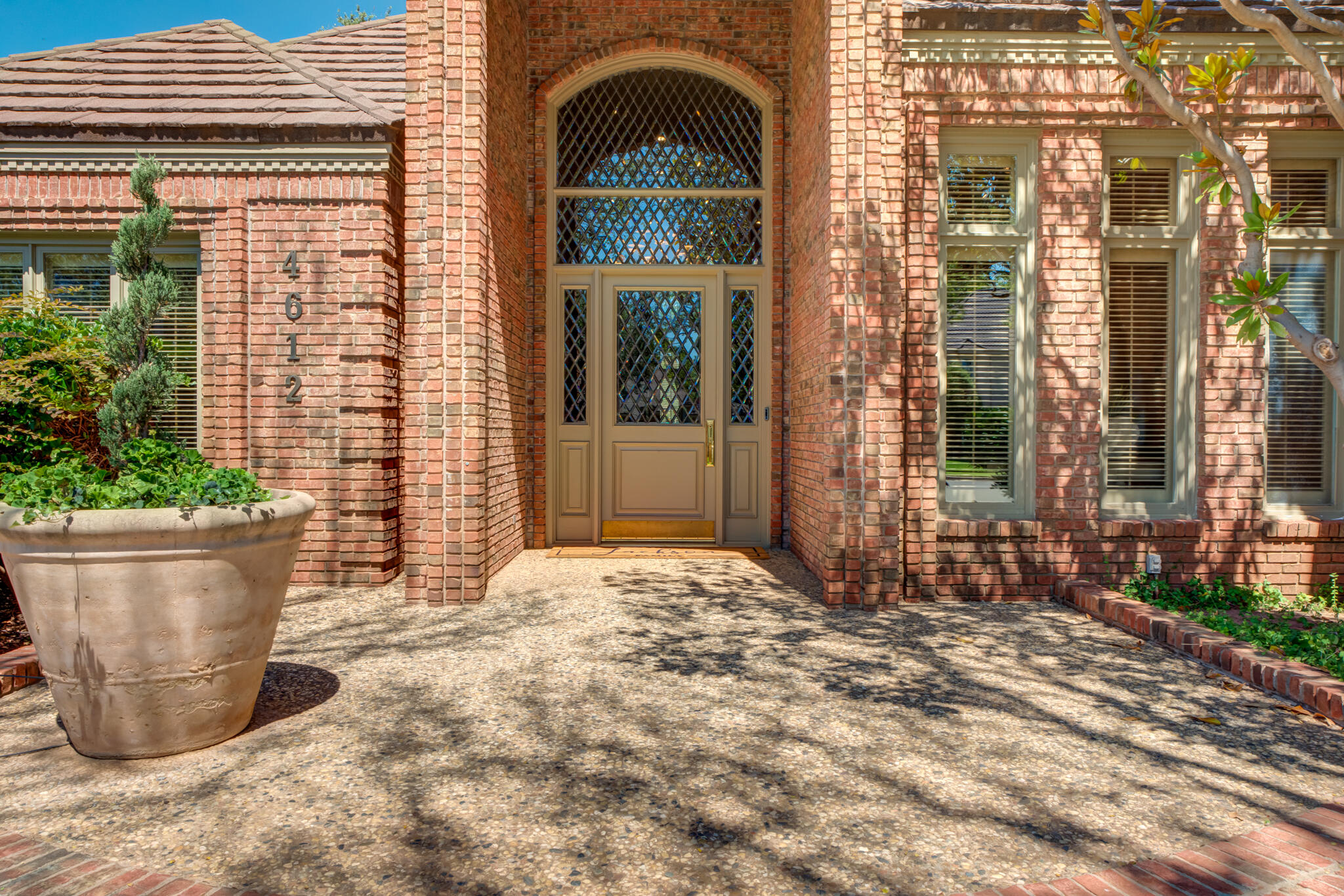 4612 91st Street Lubbock, TX 79424 - Photo 5 of 83 a view of a brick house with a large windows